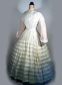 1850s cotton dress with tucked skirt - Courtesy of pastperfectvintage.com