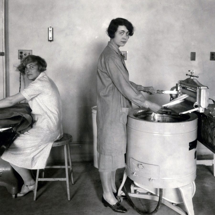 Women washing and ironing clothing in the 1920s