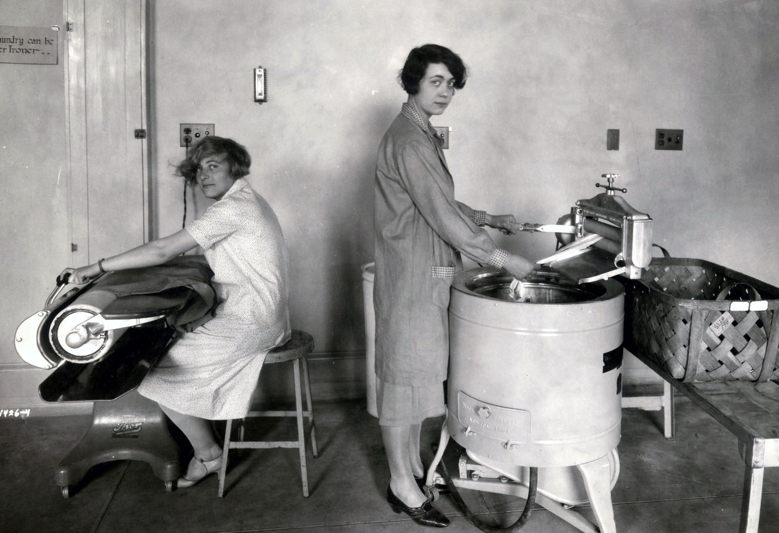 Women washing and ironing clothing in the 1920s