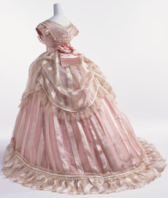 1866 pink striped silk taffeta evening dress Image via Kyoto Costume Institute