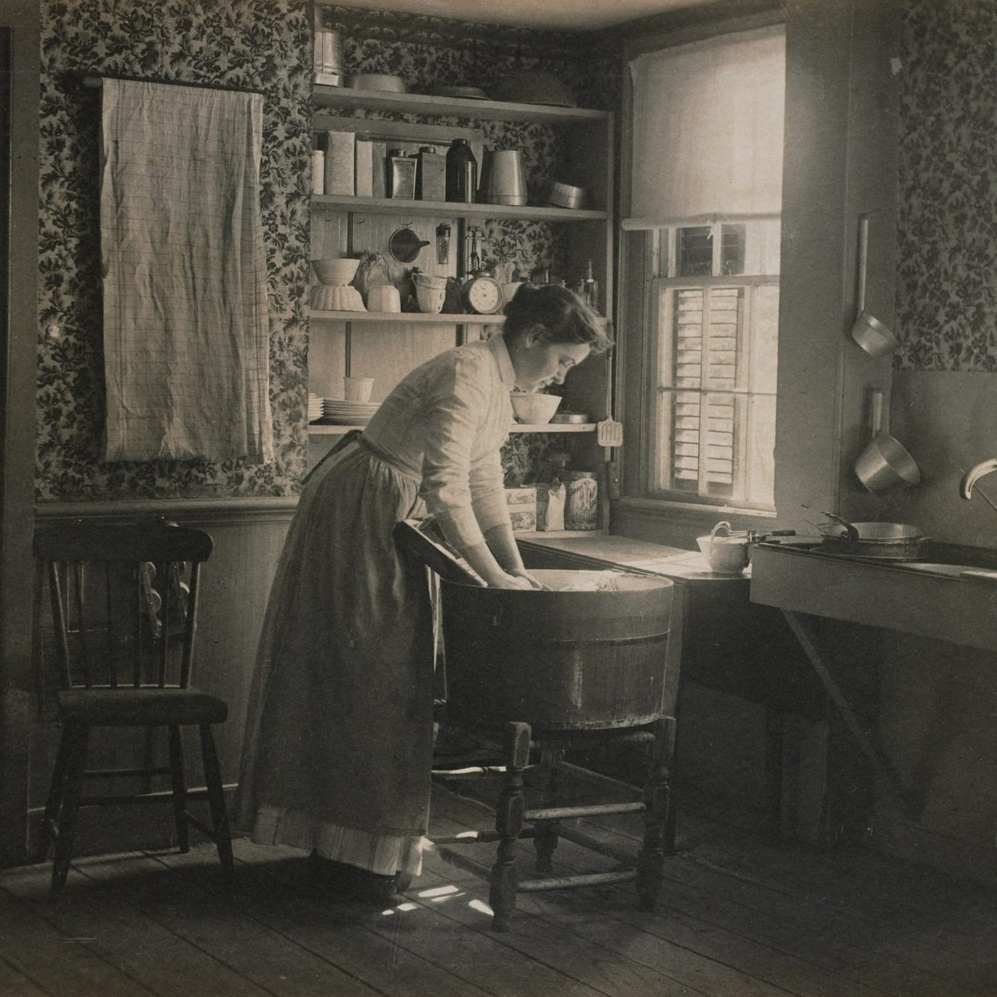 Antique photo of a woman washing or dyeing clothing