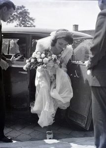 Hungarian bride getting out of car, 1948